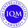 IQM Centre of Excellence Award logo Purple Pantone Ref. 2685c